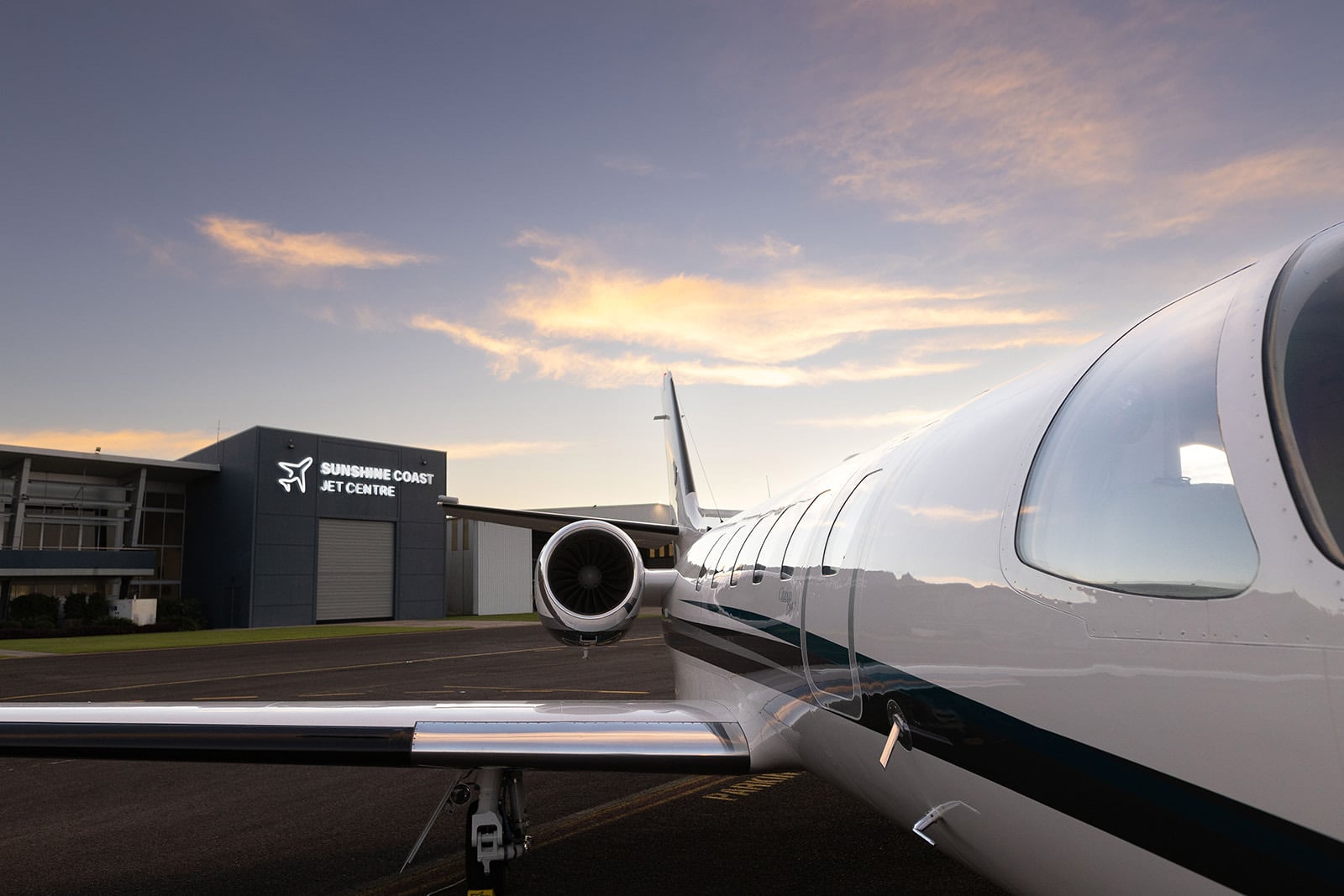 Jet Aircraft on the tarmac in front of Flight Options and Sunshine Coast Jet Centre building
