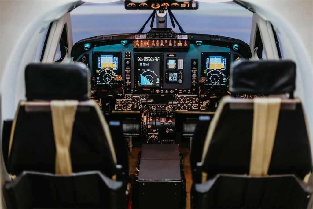 Airplane cockpit interior with seats and instruments