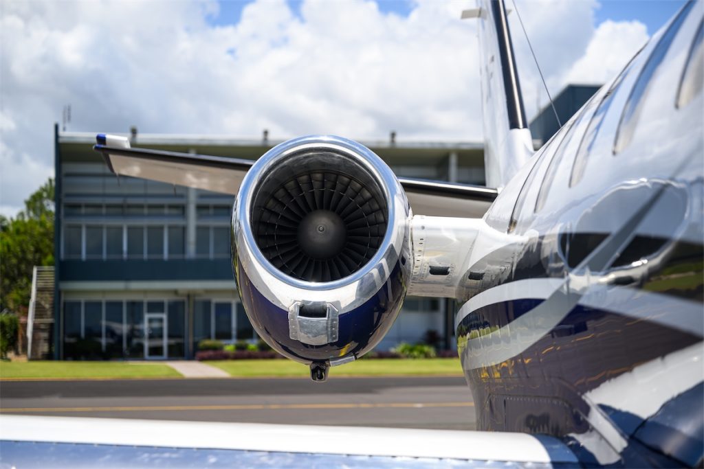 Jet engine closeup on airport tarmac.