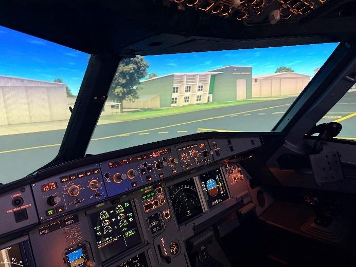 Airplane cockpit simulator with runway view