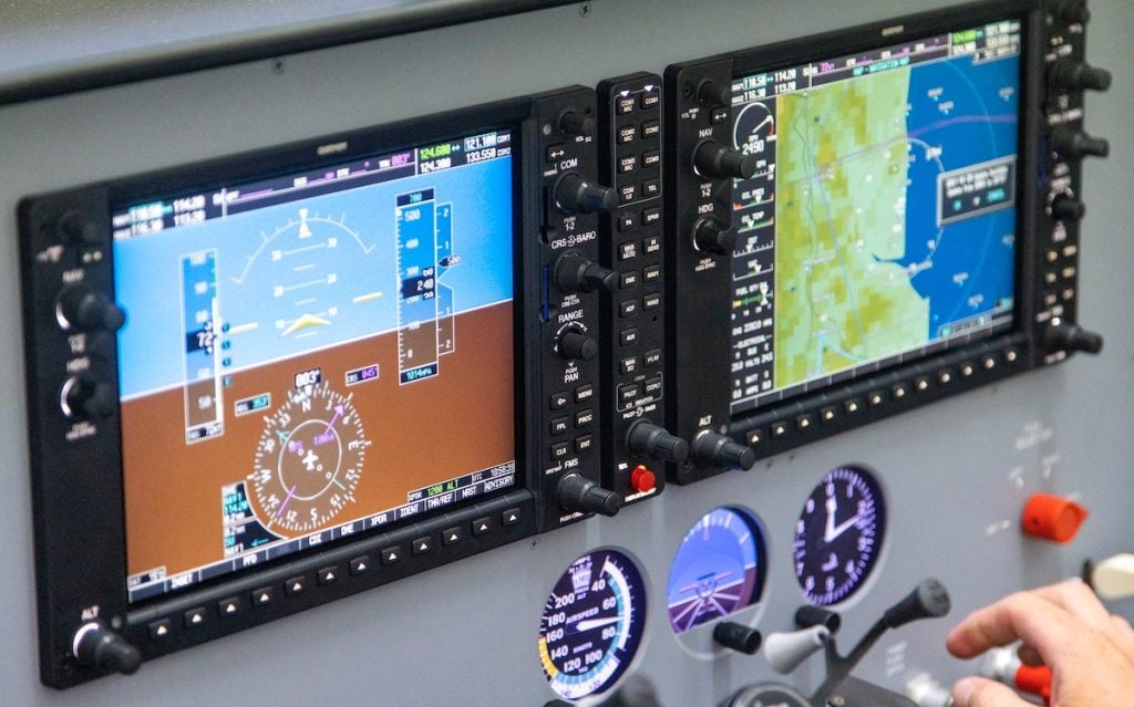 Aircraft cockpit display panel showing flight instruments in the FRASCA Seminole Fixed Training Device.